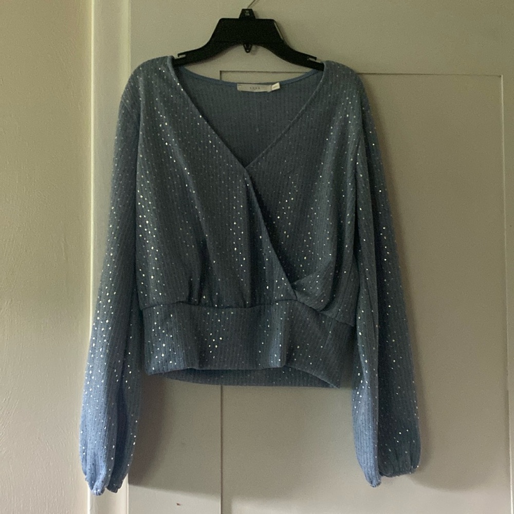 Light blue, sparkly long sleeve top. Brand is Lush. Size is Medium